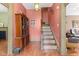 Hallway with staircase, wood floors, and classic trim at 6428 Bluff Crest Ct, Indianapolis, IN 46217