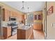 Kitchen featuring granite counters, stainless appliances, and hardwood floors at 6428 Bluff Crest Ct, Indianapolis, IN 46217