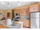 Kitchen featuring granite counters, stainless appliances, and hardwood floors at 6428 Bluff Crest Ct, Indianapolis, IN 46217