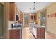 Kitchen featuring granite counters, stainless appliances, and hardwood floors at 6428 Bluff Crest Ct, Indianapolis, IN 46217