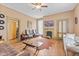 Spacious living room featuring hard wood floors, a fireplace, and lots of natural light at 6428 Bluff Crest Ct, Indianapolis, IN 46217