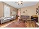 Spacious living room featuring hard wood floors, a fireplace, and lots of natural light at 6428 Bluff Crest Ct, Indianapolis, IN 46217