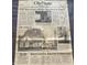 Close-up view of a vintage newspaper highlighting local news stories and events from the Indianapolis Star at 6428 Bluff Crest Ct, Indianapolis, IN 46217