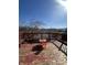 A bright deck view, shows the weathered deck with built in seating and overlooking the back yard at 6817 Everbloom Ln, Indianapolis, IN 46217