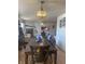 Dining area with chandelier, hardwood floors, and decorative window at 6817 Everbloom Ln, Indianapolis, IN 46217