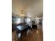 Dining room area with hardwood floors, chandelier and decorative window at 6817 Everbloom Ln, Indianapolis, IN 46217