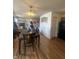 Spacious dining room with hardwood floors adjoining kitchen and living room at 6817 Everbloom Ln, Indianapolis, IN 46217