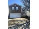 Charming two-story home with brick and siding, featuring a two-car garage and a well-maintained front yard at 6817 Everbloom Ln, Indianapolis, IN 46217