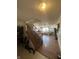 Living room with staircase, fireplace, hardwood floors and ceiling fan at 6817 Everbloom Ln, Indianapolis, IN 46217
