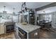 Spacious kitchen featuring stainless steel appliances, granite counters, and island with seating at 7089 W 150 N, Greenfield, IN 46140