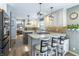 Bright, open kitchen features granite countertops, an island with bar seating, and stainless appliances at 7089 W 150 N, Greenfield, IN 46140