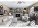 Cozy living room with a brick fireplace, comfortable seating, and stylish decor elements at 7089 W 150 N, Greenfield, IN 46140