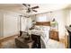 This bedroom features a ceiling fan, hardwood flooring, and barn door to the bathroom at 7089 W 150 N, Greenfield, IN 46140