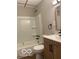 Updated bathroom features a shower-tub combo, modern vanity, and updated fixtures at 1220 E Second St, Greenfield, IN 46140