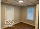 Bright bedroom featuring wood floors, neutral walls, and ample natural light at 1220 E Second St, Greenfield, IN 46140