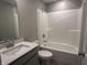 Bathroom featuring a single sink vanity with modern fixtures and a tub and shower combination at 1256 Turner Trace N Pl, Avon, IN 46123