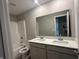 Bathroom featuring a double vanity with modern fixtures and a tub and shower combination at 1256 Turner Trace N Pl, Avon, IN 46123