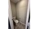Compact half-bathroom with modern toilet and neutral wall paint at 1256 Turner Trace N Pl, Avon, IN 46123
