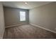 Bright, carpeted bedroom features a window letting in natural light at 1256 Turner Trace N Pl, Avon, IN 46123