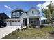 Beautiful two-story home boasting a three-car garage and professionally landscaped yard at 1256 Turner Trace N Pl, Avon, IN 46123