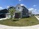 Elegant two-story home with three-car garage, manicured lawn, and lush landscaping at 1256 Turner Trace N Pl, Avon, IN 46123