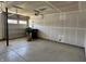 Spacious garage with concrete floors and an automatic garage door at 1256 Turner Trace N Pl, Avon, IN 46123