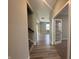 Inviting hallway with wood-look floors, showcasing a view through to various rooms, promoting a sense of flow at 1256 Turner Trace N Pl, Avon, IN 46123