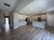 Bright, open-concept kitchen with stainless steel appliances and sleek wood flooring at 1256 Turner Trace N Pl, Avon, IN 46123