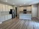 Open kitchen design with stainless steel appliances, white cabinets, and island at 1256 Turner Trace N Pl, Avon, IN 46123