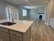 Open-concept kitchen featuring granite countertops, modern sink, and seamless flow into the living area at 1256 Turner Trace N Pl, Avon, IN 46123