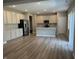 Spacious kitchen with an island, modern stainless steel appliances, and hardwood floors at 1256 Turner Trace N Pl, Avon, IN 46123