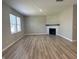Spacious living room featuring a fireplace, lots of natural light, and hardwood floors at 1256 Turner Trace N Pl, Avon, IN 46123