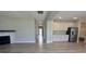 Open layout seamlessly integrates living area, hallway, and kitchen for easy flow and bright, airy ambiance at 1256 Turner Trace N Pl, Avon, IN 46123