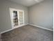Bright office space with gray walls and double French doors providing privacy and natural light at 1256 Turner Trace N Pl, Avon, IN 46123