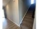 Carpeted staircase in a neutral color scheme, showcasing a smooth transition between floors at 1256 Turner Trace N Pl, Avon, IN 46123