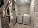 Well-organized utility room with washer, dryer, furnace and shelving at 1256 Turner Trace N Pl, Avon, IN 46123