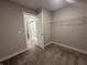Bedroom view to walk-in closet featuring open shelving and a view of the ensuite bathroom at 1256 Turner Trace N Pl, Avon, IN 46123