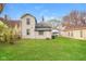 Back exterior view of home highlighting its backyard with lawn at 1343 Edgemont Ave, Indianapolis, IN 46208