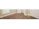 Bedroom corner showcasing carpet, base trim, a window, and doorway at 1343 Edgemont Ave, Indianapolis, IN 46208