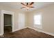 Bedroom with ceiling fan, neutral walls, and large window at 1343 Edgemont Ave, Indianapolis, IN 46208