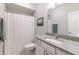 Clean bathroom featuring a granite countertop, white vanity, and shower with a decorative curtain at 15576 Marsden Dr, Westfield, IN 46074