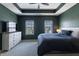 The main bedroom featuring a ceiling fan, carpet, and two bright windows at 15576 Marsden Dr, Westfield, IN 46074