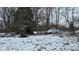Image of a messy backyard in winter showing a car and shed at 1621 Indiana Ave, Anderson, IN 46012