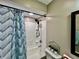 Bright bathroom featuring a white tub, decorative shower curtain, and modern fixtures at 1820 N Dequincy St, Indianapolis, IN 46218