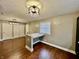 Dining area with a built in desk nook, window, and stylish lighting fixture, perfect for meals and gatherings at 1820 N Dequincy St, Indianapolis, IN 46218