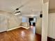 Bright dining area featuring hardwood floors, a modern pendant light, and an open view of the stylish kitchen at 1820 N Dequincy St, Indianapolis, IN 46218