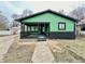 Charming single-story home boasts a covered front porch, a freshly painted exterior, and easy access to the front walkway at 1820 N Dequincy St, Indianapolis, IN 46218
