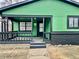 Charming front porch with painted siding and trim, with a view of the front door at 1820 N Dequincy St, Indianapolis, IN 46218