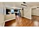 Modern kitchen boasts stainless steel appliances, dark cabinetry, and a view into the adjacent dining area at 1820 N Dequincy St, Indianapolis, IN 46218