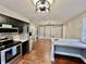 View of kitchen with stainless steel appliances, breakfast bar and view of the dining area at 1820 N Dequincy St, Indianapolis, IN 46218